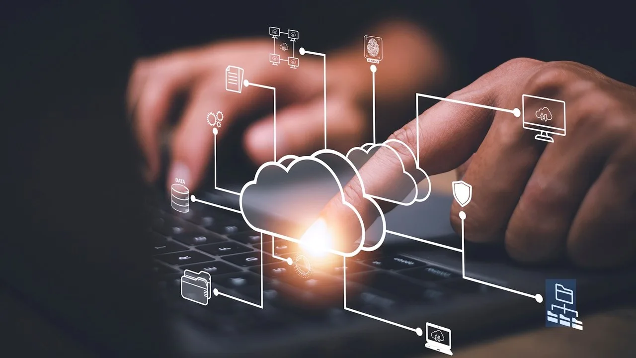 Person typing with cloud computing